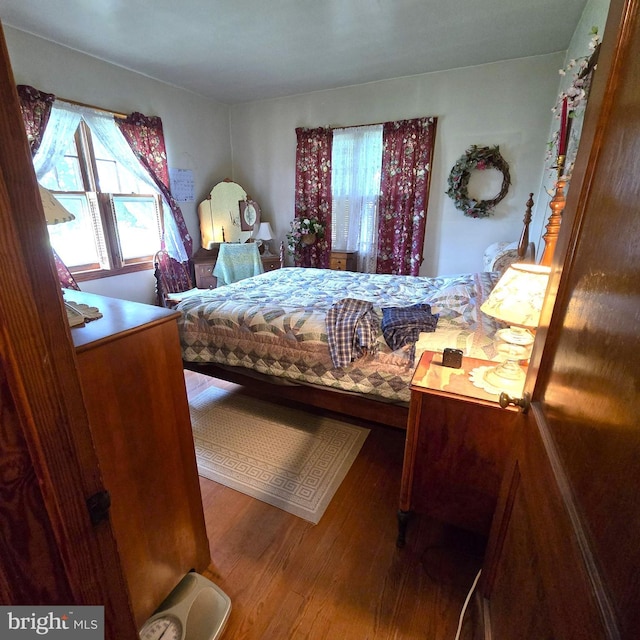 bedroom featuring wood finished floors