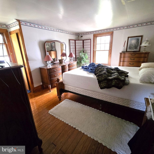 bedroom featuring wood finished floors