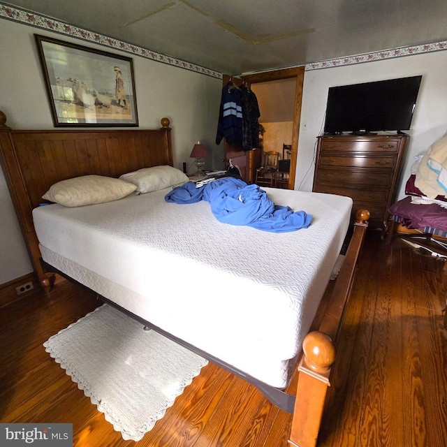 bedroom featuring wood finished floors