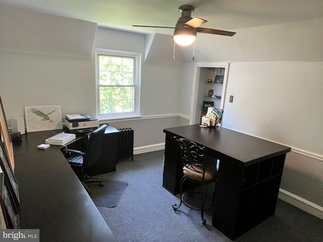 office area featuring dark carpet, radiator, and ceiling fan