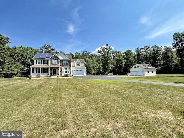 view of yard featuring a garage and a porch