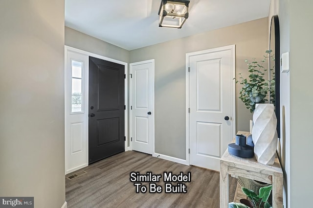 foyer entrance with hardwood / wood-style floors