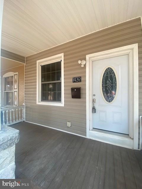 doorway to property with a porch