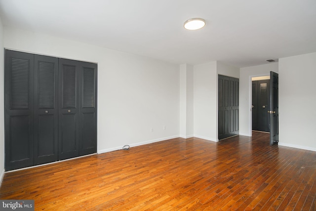 unfurnished bedroom featuring wood-type flooring