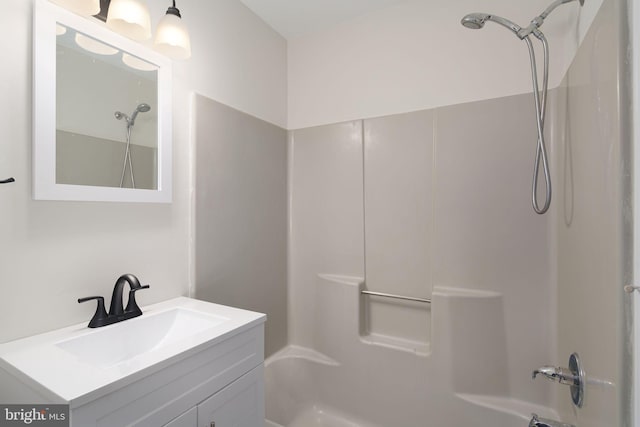 bathroom featuring bathing tub / shower combination and vanity