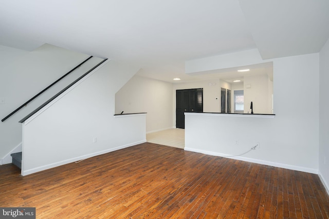 bonus room with hardwood / wood-style floors