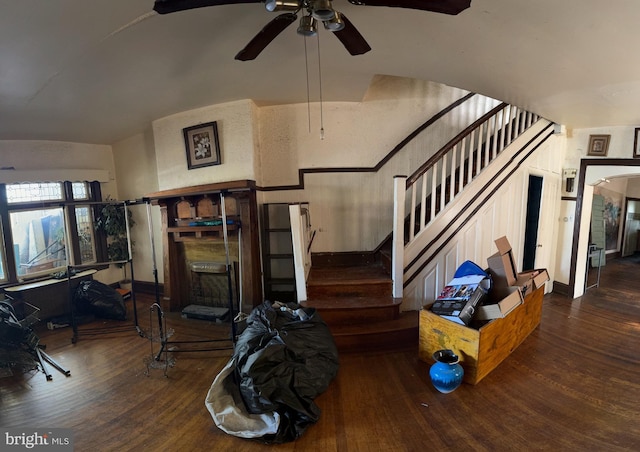 living room featuring ceiling fan and hardwood / wood-style floors