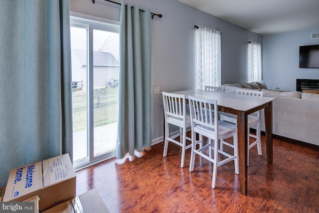 dining area featuring dark hardwood / wood-style floors