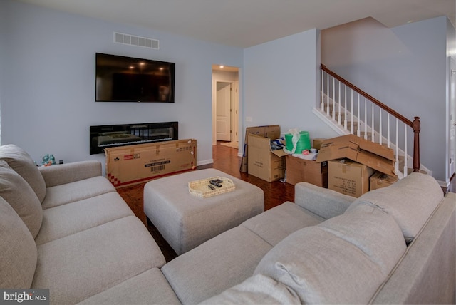 living room with dark hardwood / wood-style floors