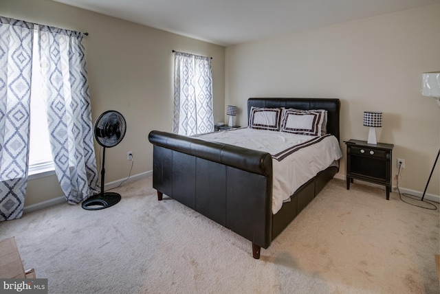 bedroom featuring light colored carpet