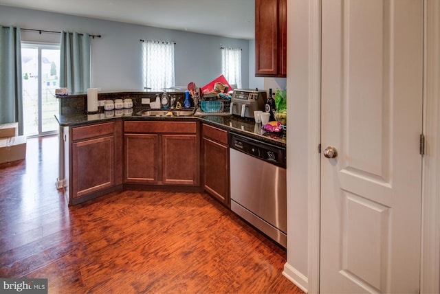 kitchen with dishwasher, dark wood-type flooring, and plenty of natural light