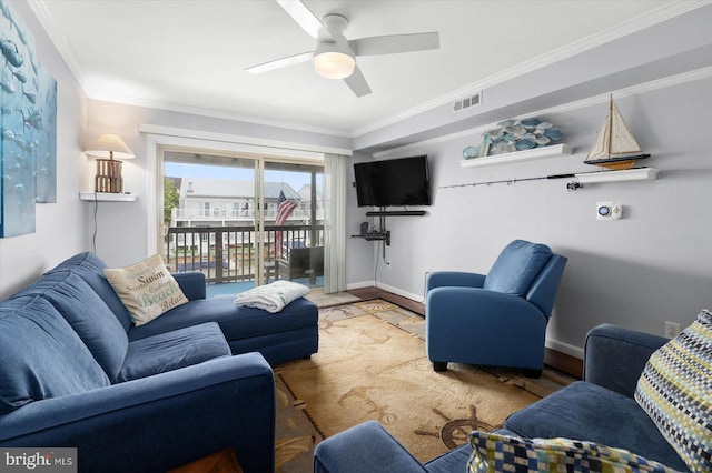 living room with crown molding and ceiling fan