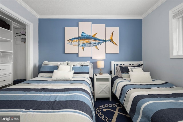 carpeted bedroom featuring ornamental molding and a textured ceiling