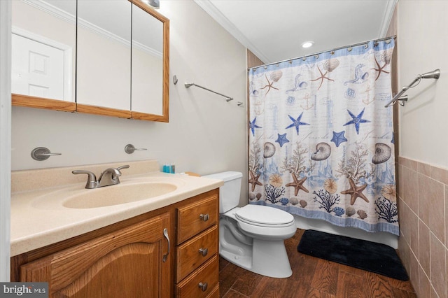 bathroom featuring hardwood / wood-style flooring, vanity, ornamental molding, and toilet