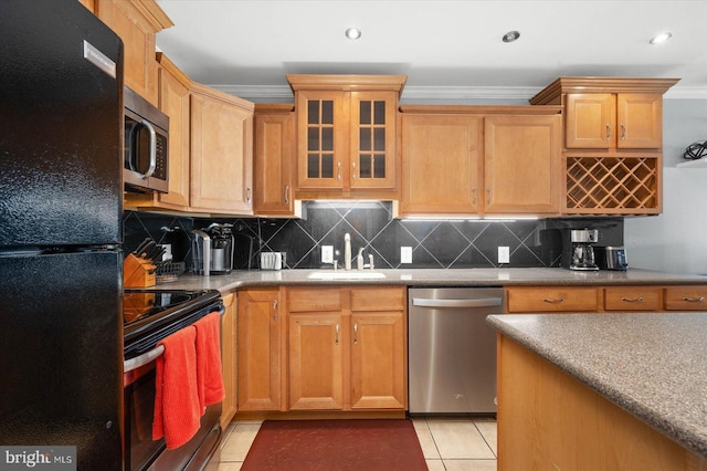 kitchen with light tile patterned flooring, sink, crown molding, appliances with stainless steel finishes, and backsplash