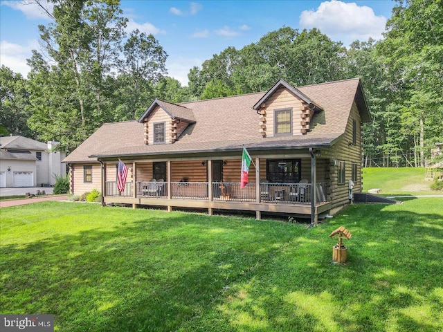 log home featuring a garage and a front yard