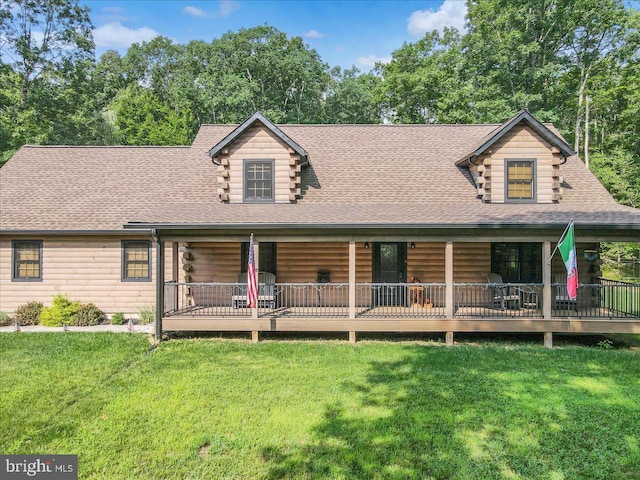 log cabin with a front lawn