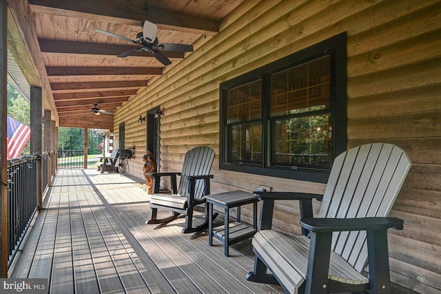 wooden terrace featuring ceiling fan