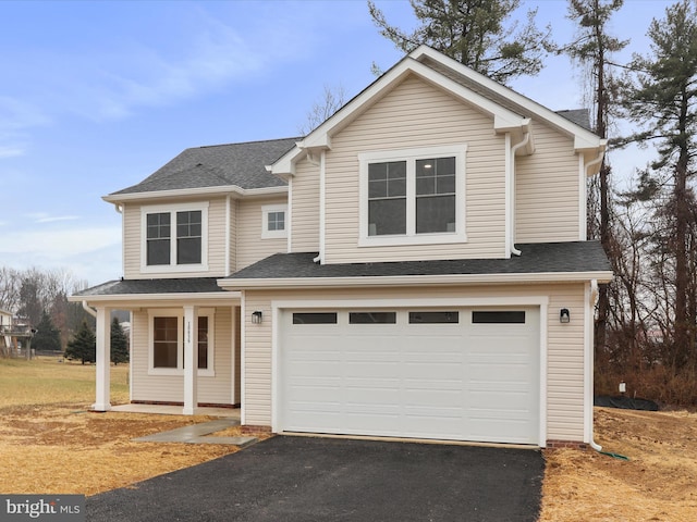 front of property with a garage and a porch