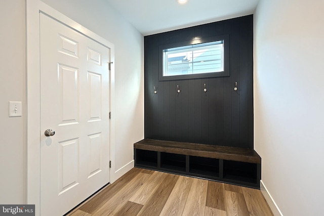 mudroom with light hardwood / wood-style floors