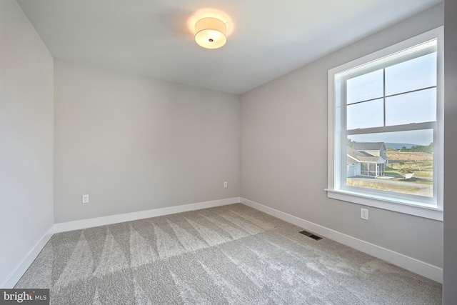 unfurnished room with carpet floors