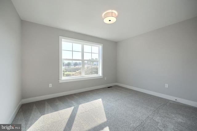 empty room with carpet flooring