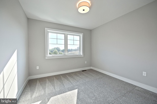 unfurnished room with carpet