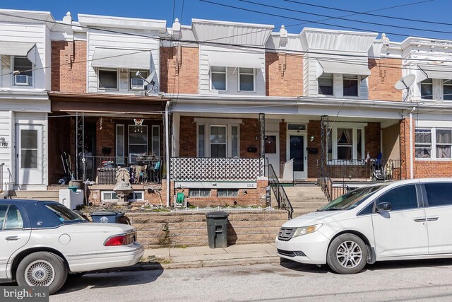 multi unit property featuring a porch