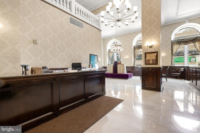 reception area with an inviting chandelier