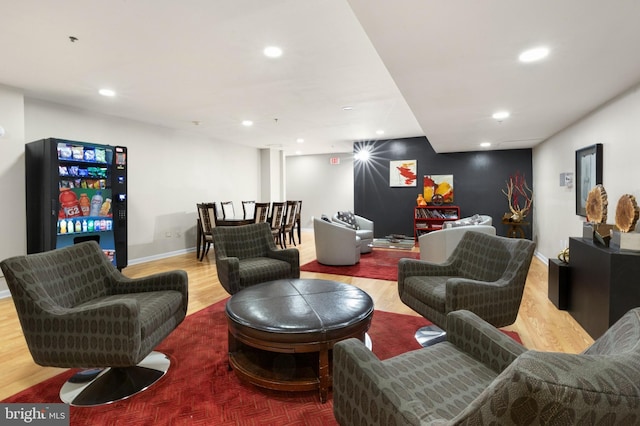 living room featuring recessed lighting, baseboards, and wood finished floors