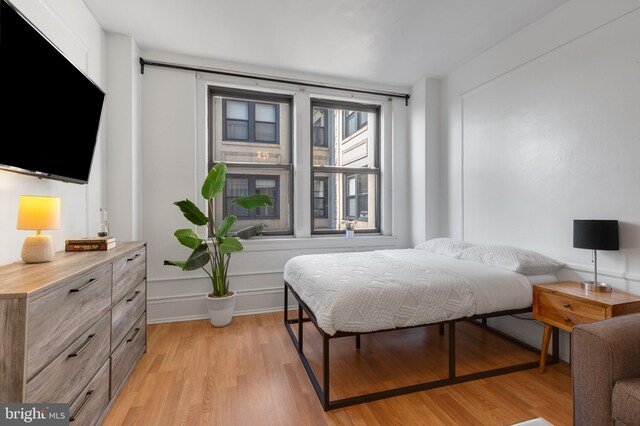 bedroom with light hardwood / wood-style flooring