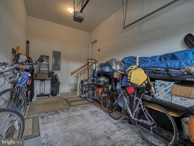 garage with electric panel and a garage door opener