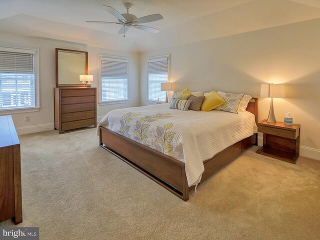 carpeted bedroom featuring ceiling fan