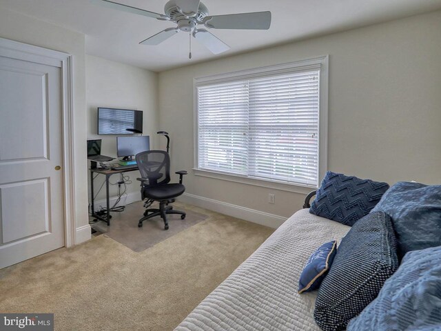 carpeted bedroom with ceiling fan