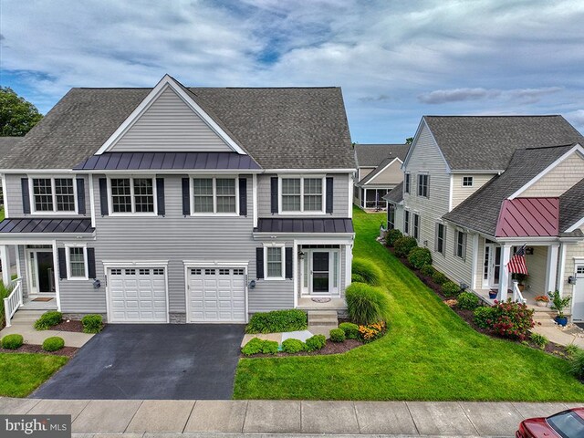 front of property with a garage and a front yard