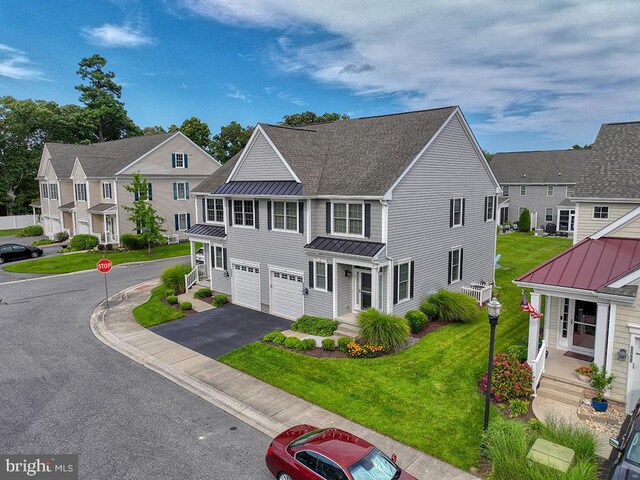 view of front of house featuring a garage and a front yard