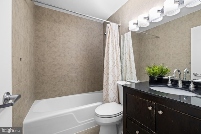 full bathroom with vanity, toilet, and shower / bath combo with shower curtain