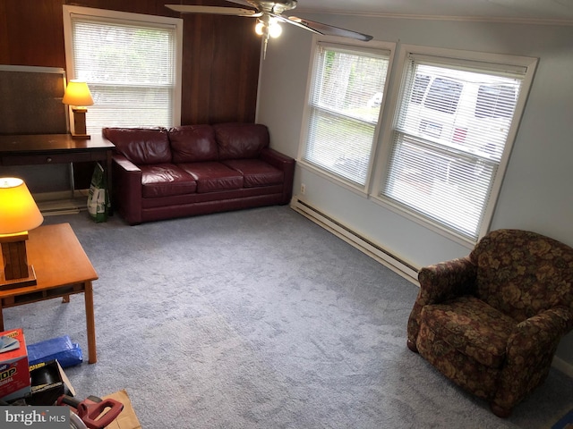 living room with a baseboard radiator, a healthy amount of sunlight, and light colored carpet