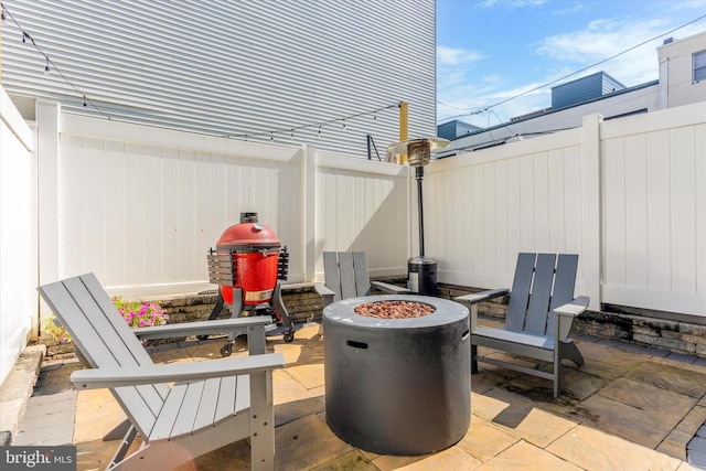 view of patio featuring a fire pit