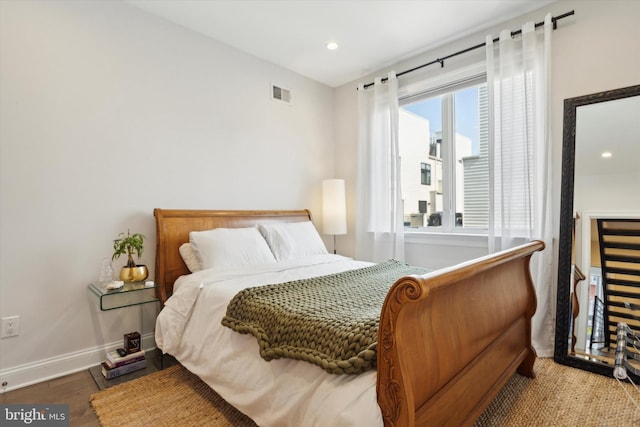 bedroom with hardwood / wood-style floors