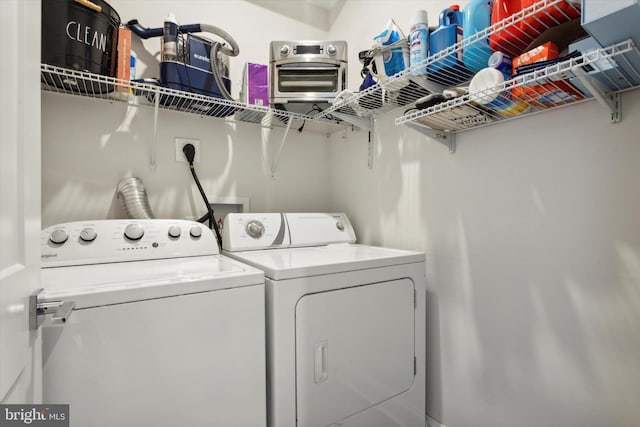 laundry room featuring separate washer and dryer