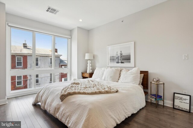 bedroom featuring dark hardwood / wood-style flooring