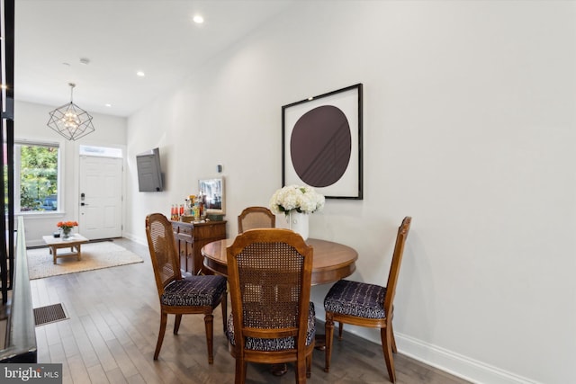 dining area with hardwood / wood-style flooring