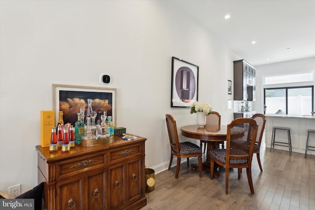 dining space featuring light wood-type flooring