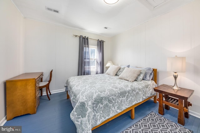 bedroom with hardwood / wood-style flooring