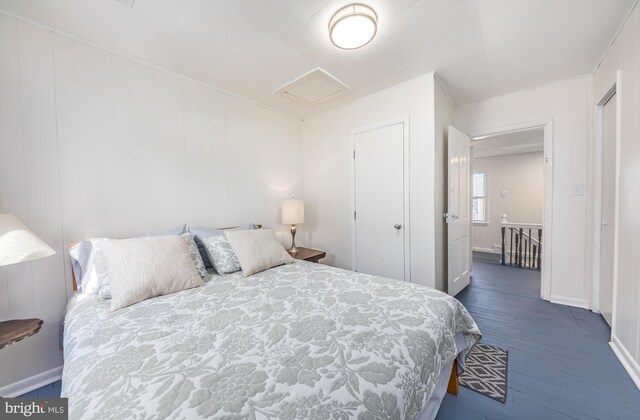 bedroom featuring dark hardwood / wood-style flooring