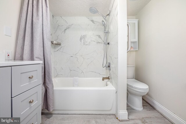 full bathroom with vanity, a textured ceiling, wood-type flooring, and toilet