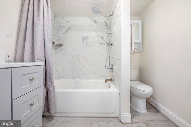 full bathroom with shower / tub combo with curtain, vanity, a textured ceiling, and toilet