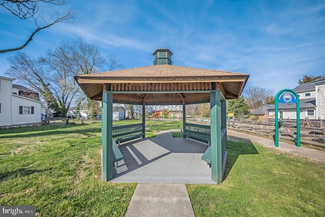 view of home's community with a gazebo and a yard