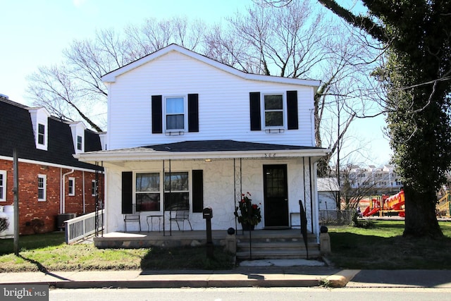 view of front facade featuring cooling unit and covered porch